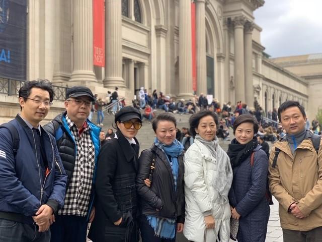 "The Visiting Scholars  team poses for a photo in front of the MET museum in NY.”