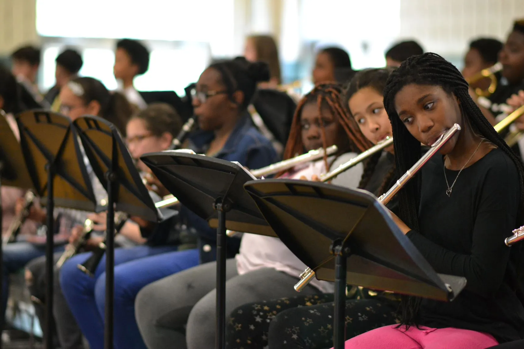 students playing wind instruments in school band