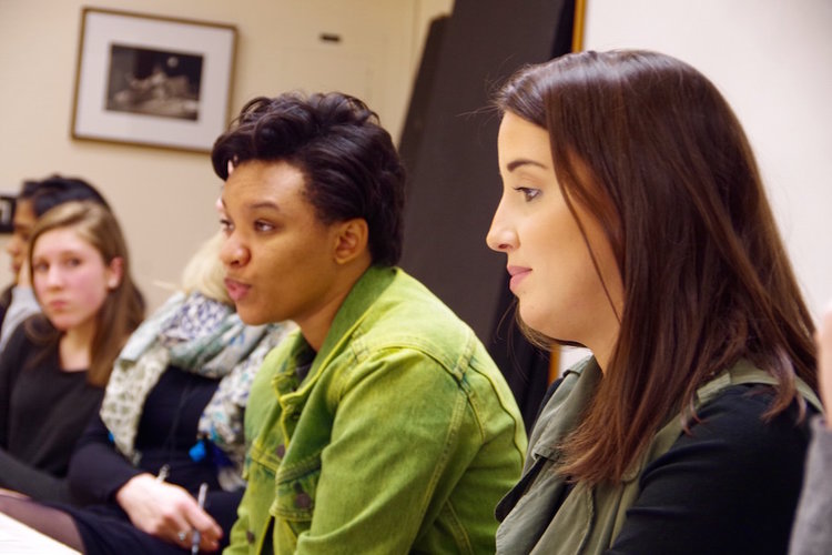 Treneé McGee (in the green) sculpts her feedback for the students. 