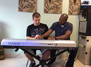 Drew Gambardella and Eric Davis during music therapy