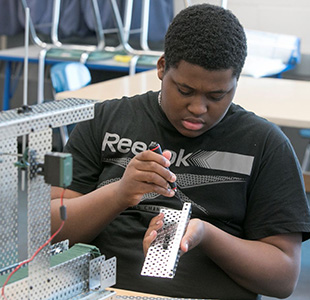 student working on automation robotics project