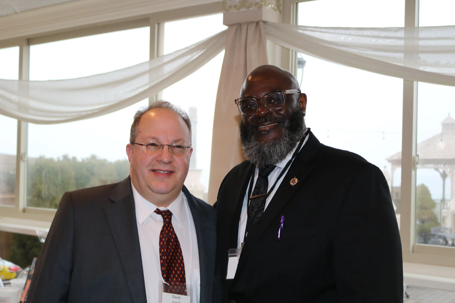 2 men at the gala smiling