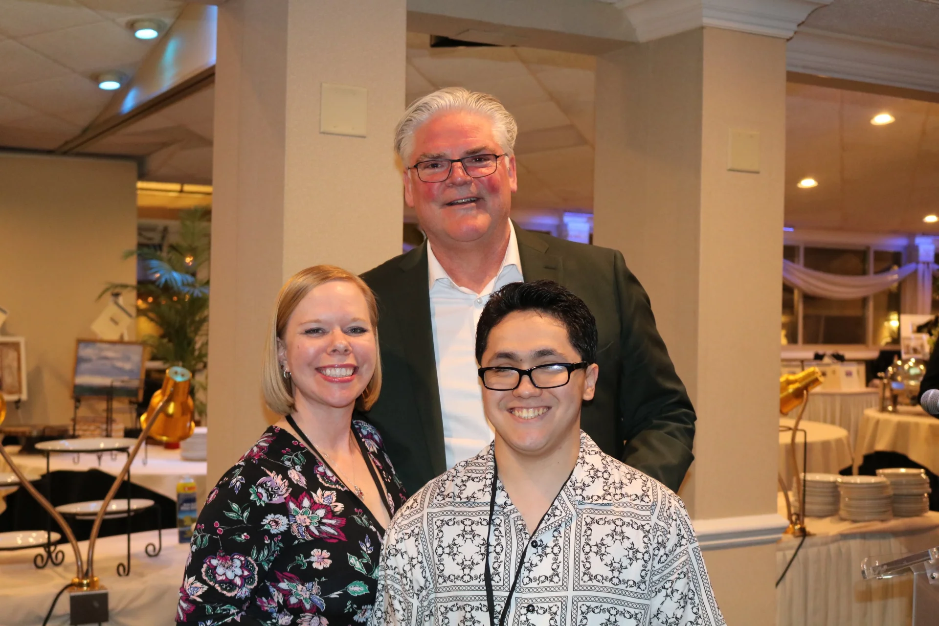 Tom Danehy and 2 others smiling