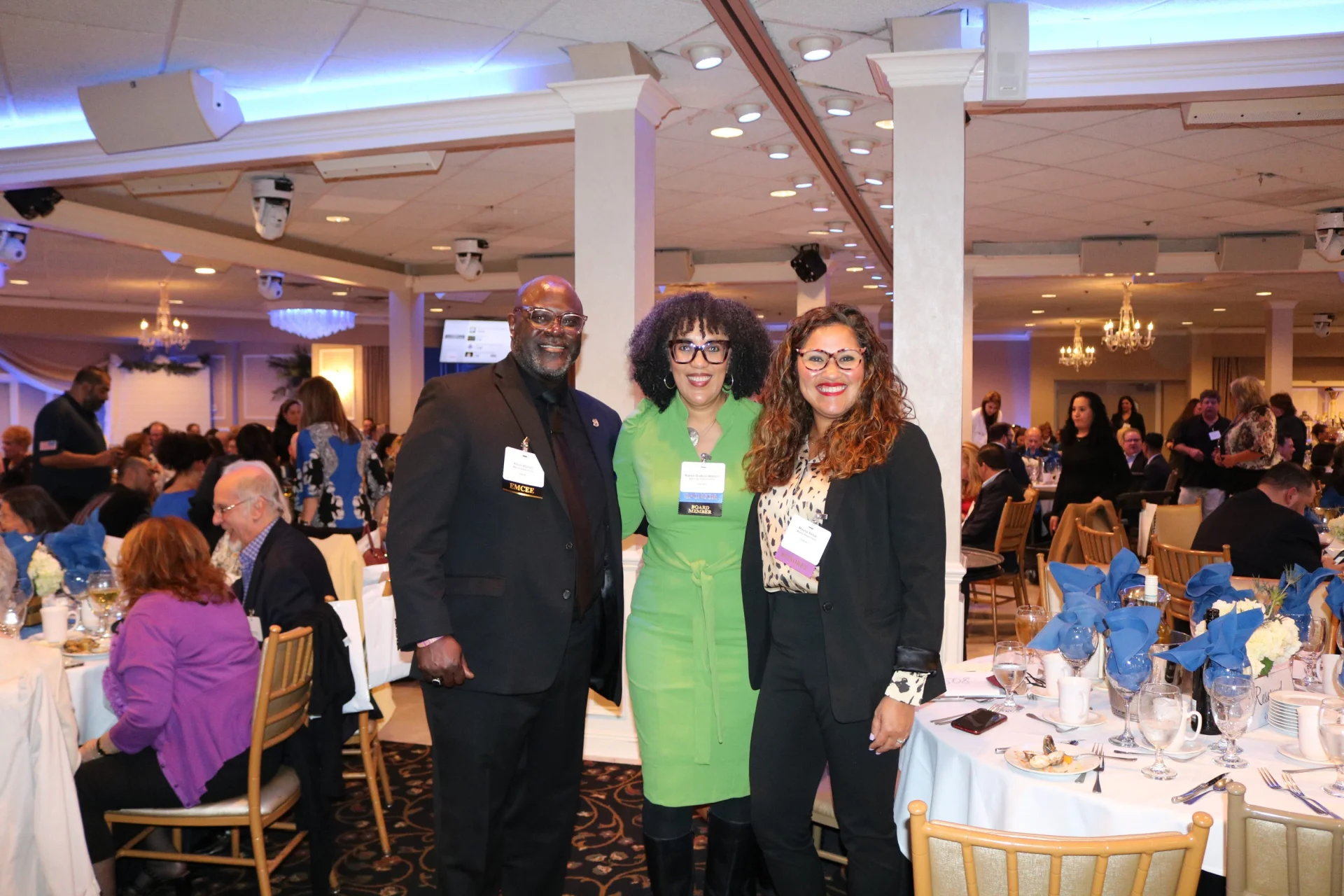 3 gala attendees smiling