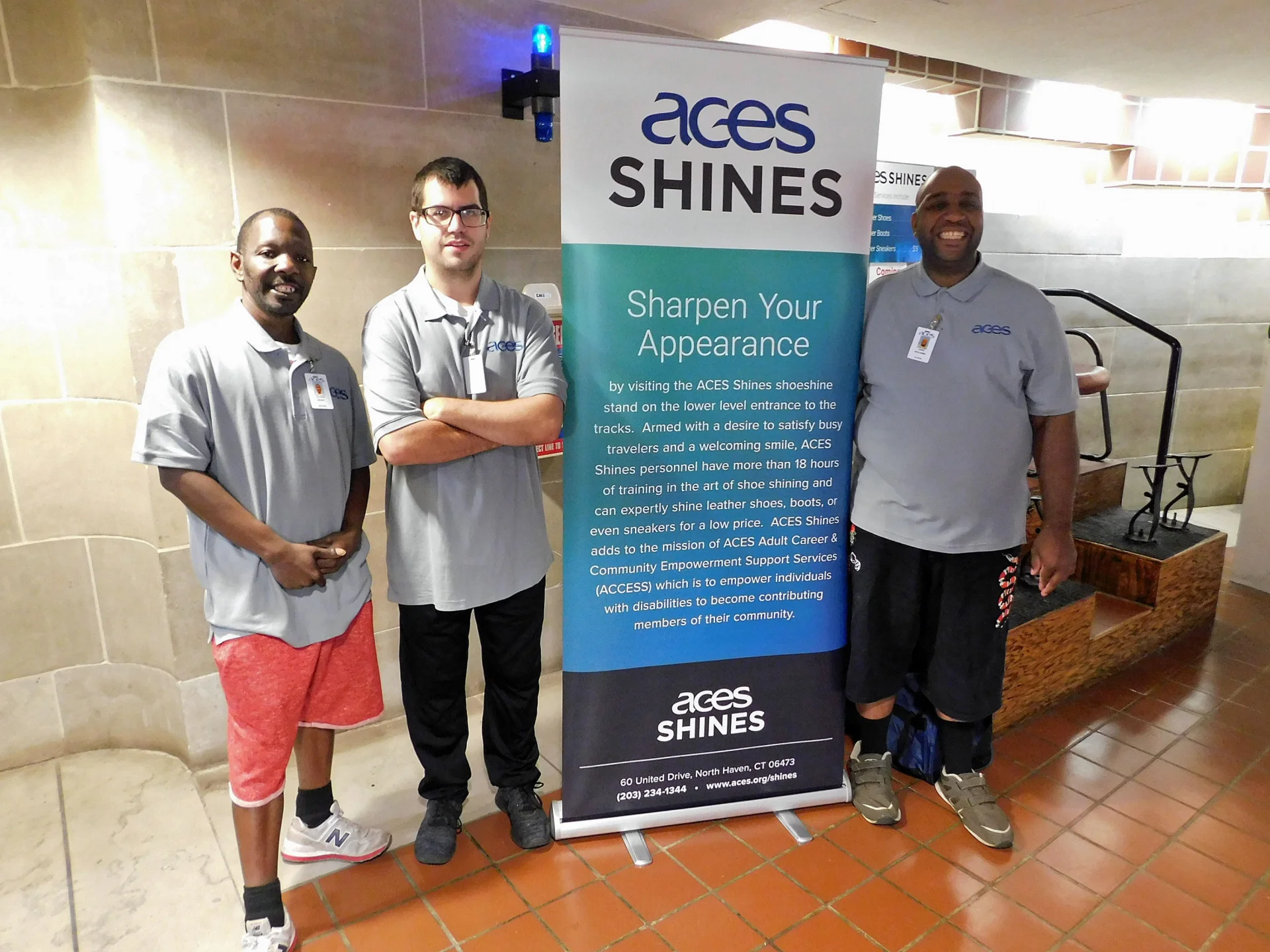ACES Shines sign and 3 workers