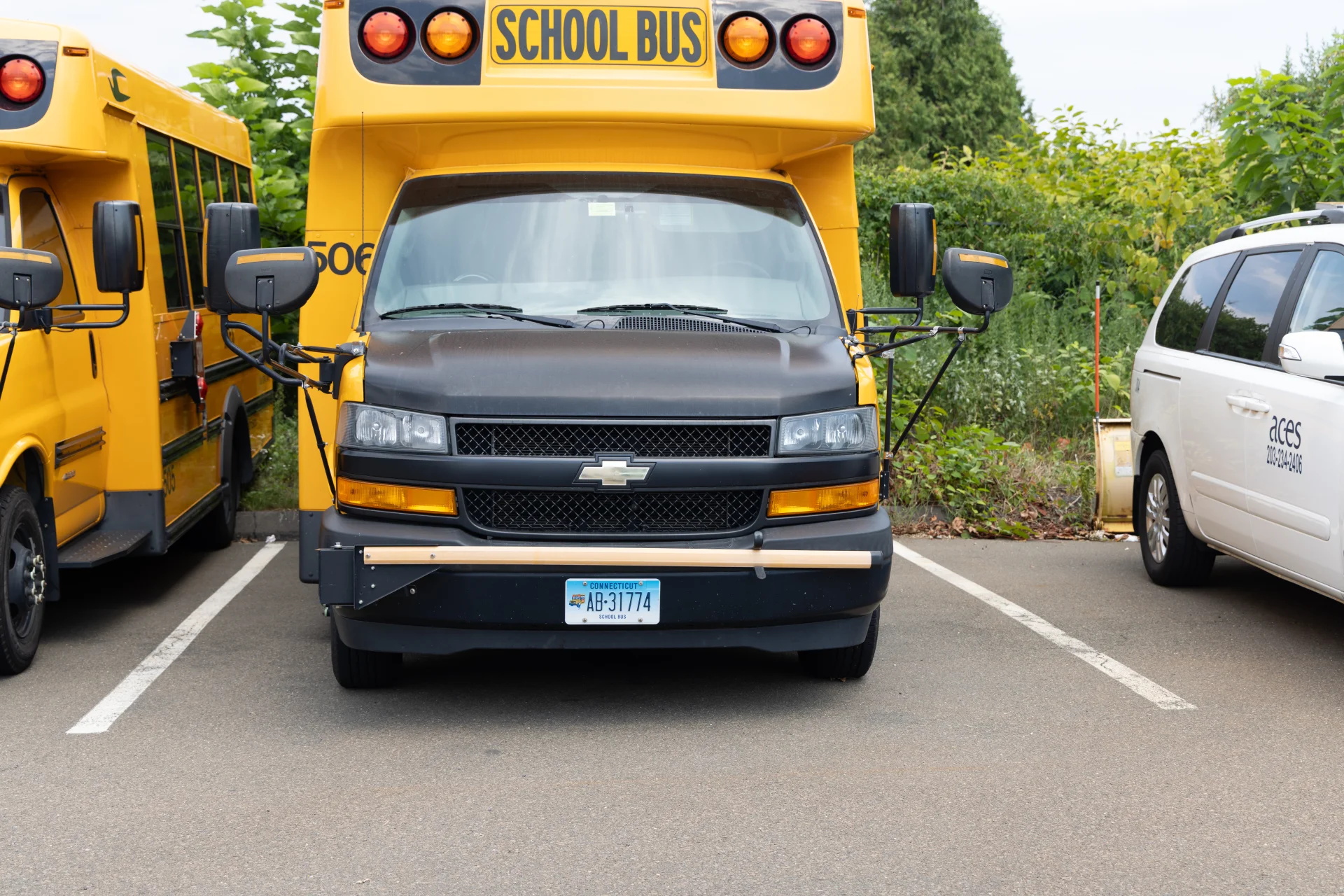 front of short yellow school bus
