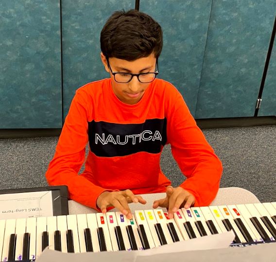 student playing piano