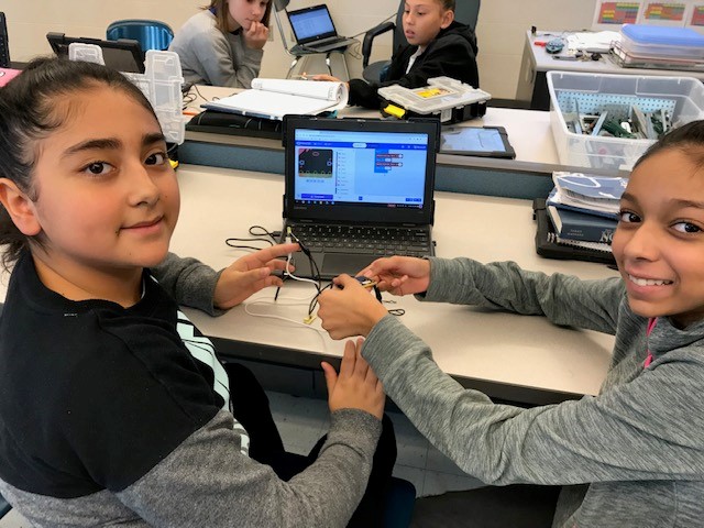 students using technology in engineering class
