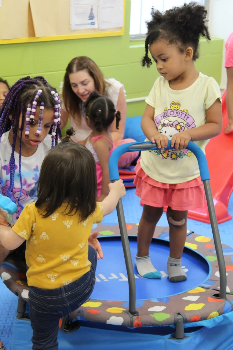 students using small trampoline