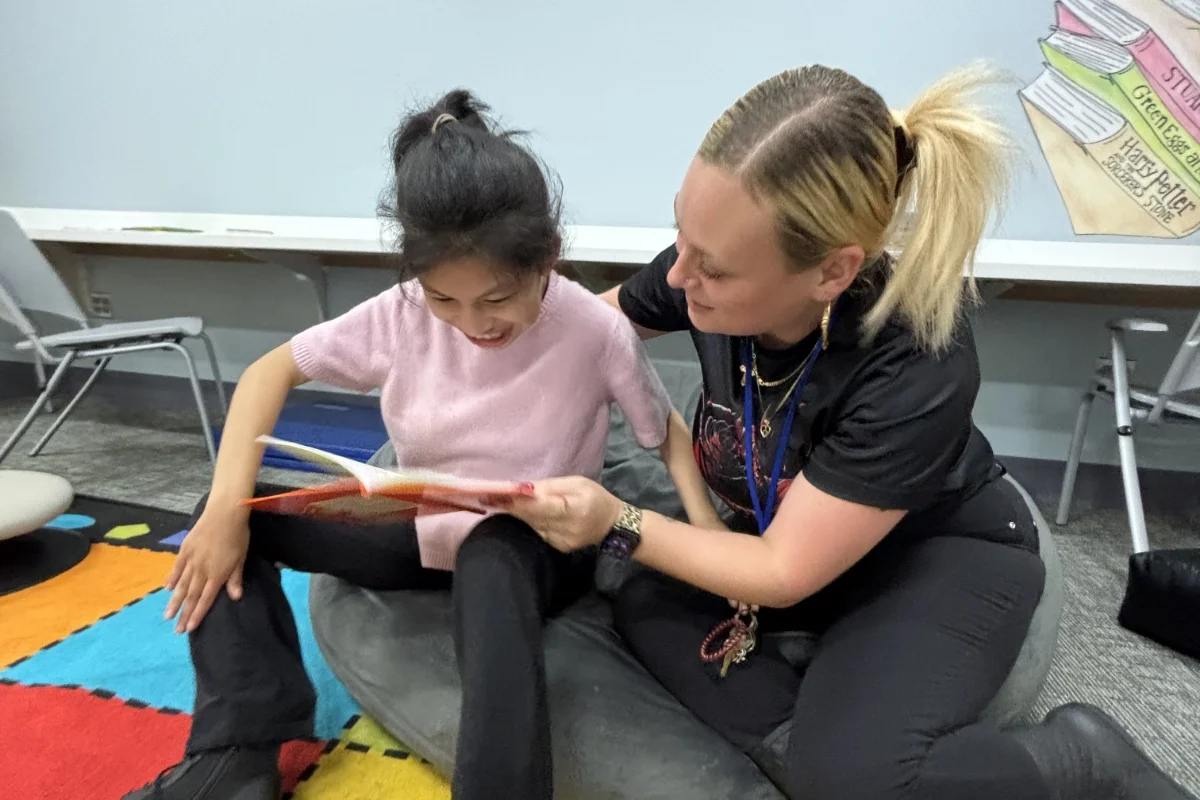 Whitney Academy teacher and student reading