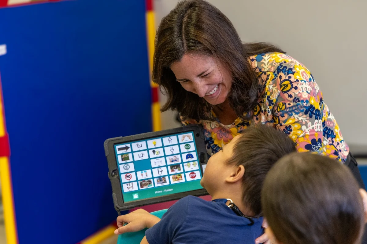 teacher and student using text-to-speech tablet