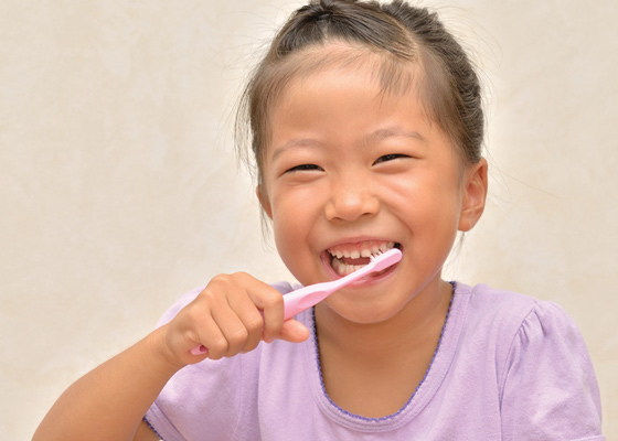 Little girl brushing teeth